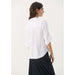 Part Two, naisten valkoinen pellava paitapusero. Takakuva mallin päällä.
