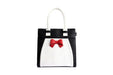 Lola Ramonan suloinen käsilaukku, malli Angel Red Bow. Mustavalkoinen laukku, jossa edessä punainen rusetti.